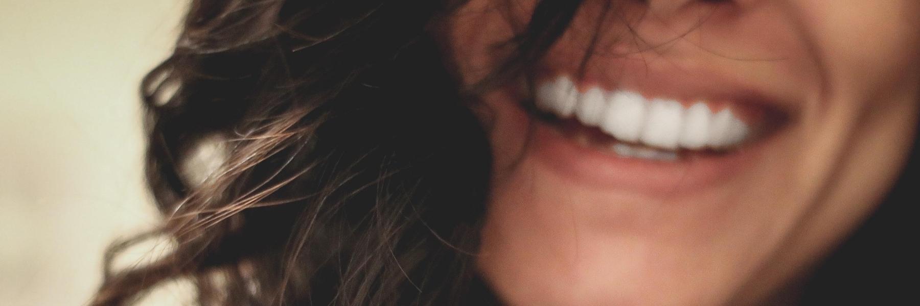 Woman smiling after straightening her teeth