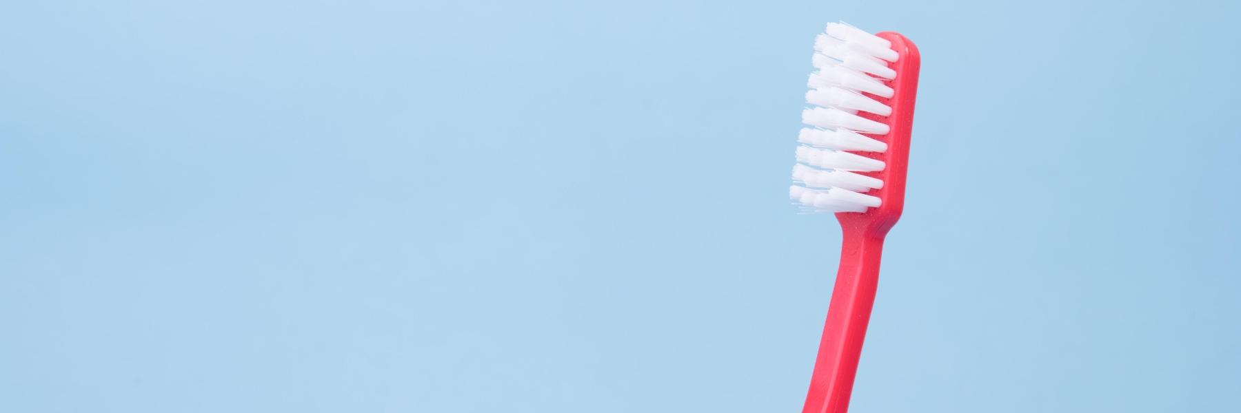 Red tooth brush at dentist office in Fontana CA