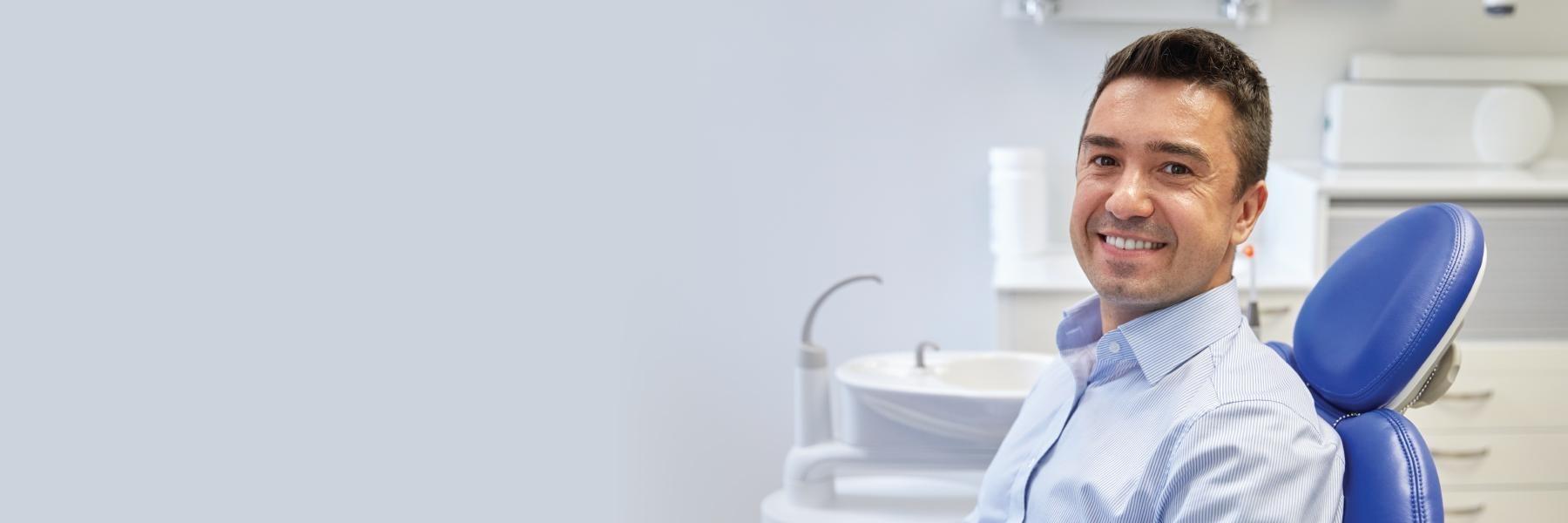 Man smiling in dental chair | Dentist Fontana CA