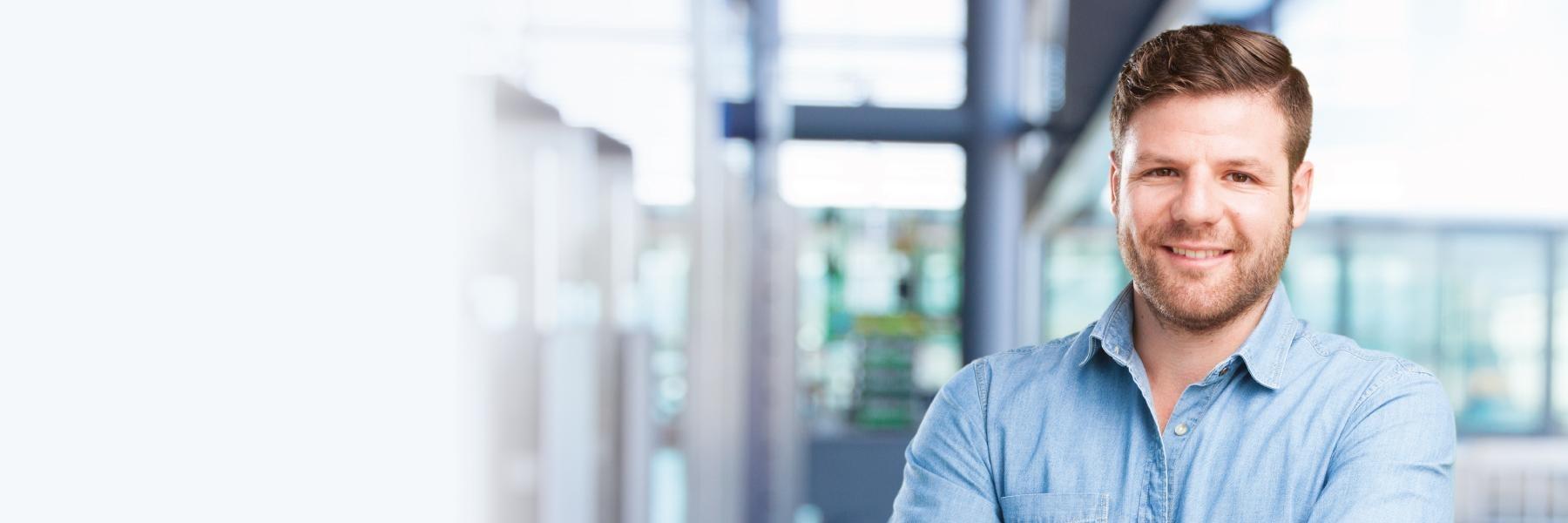 Man smiling in office | Dentist Fontana CA