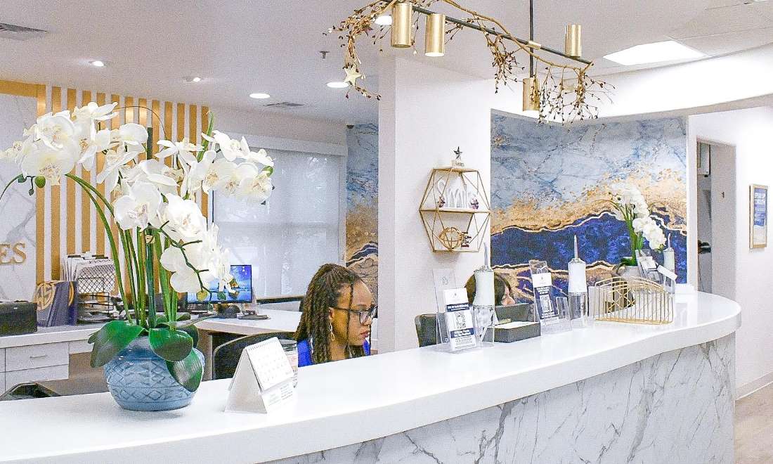 Side view of front desk of winningsmiles custom dentistry & implant center, fontana ca